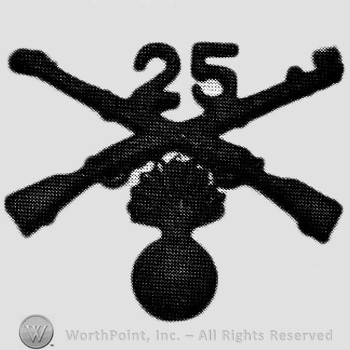 Insignia consisted of crossed rifles, number 25 above the intersectin and a shell with flame, below.