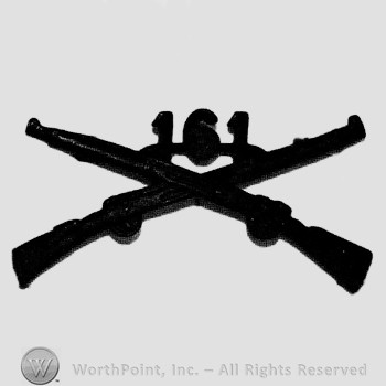 Insignia consisted of crossed rifles and number 161 above the intersection.