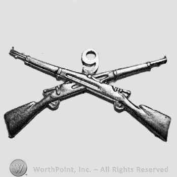 Insignia consisted of crossed rifles and number 9 above the intersection.