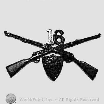 Insignia consisted of crossed rifles, number 16 above the intersection and a shield below.
