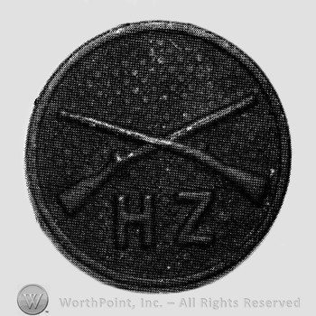 Insignia consisted of crossed rifles and letters HZ below, all on a disc.