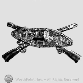 Insignia consisted of crossed rifles and side view of a tank.