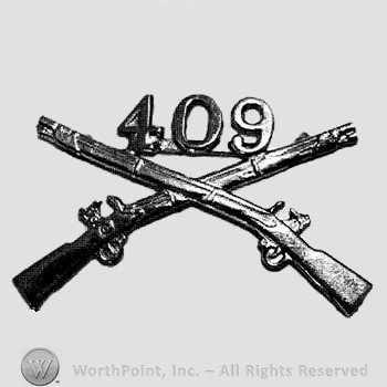 Insignia consisted of crossed rifles and number 409 above the intersection.