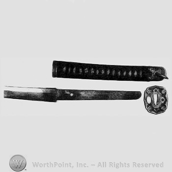 WWII Samurai sword w/leather covered scabbard.