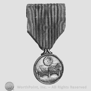 2600th national anniversary commemorative medal; flower and a bridge on the medal.