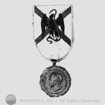 French medal for the mexican campaign; eagle and snake on the ribbon, and a man's head on the plate.