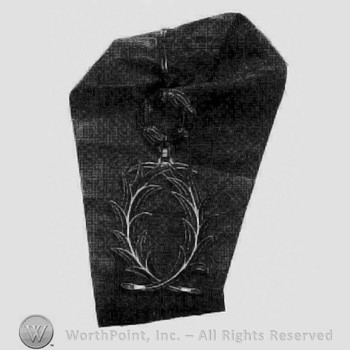 Medal in shape of wreath.