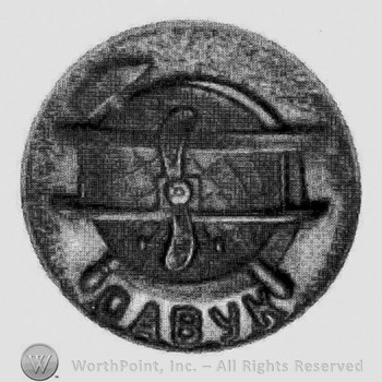 Badge with a hummer and a propeller; letters OABYK below.