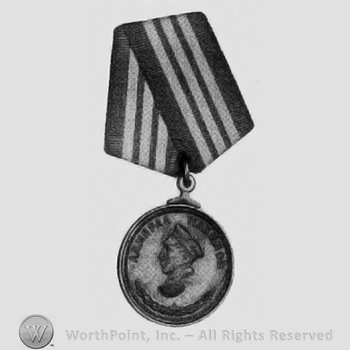 Dull gilt brass pendant on hard mtd bi-fold ribbon; medal.