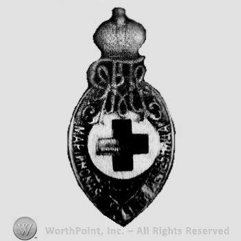 Silver tear drop shape enamel Red Cross in center & silver crown over cypher above.