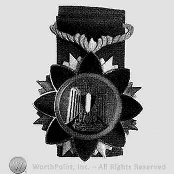 Starburst backing, eagle center, tricolor enamel shield on chest and enamel borders.