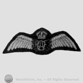 Letters RAF over a circle with wings; crown above.