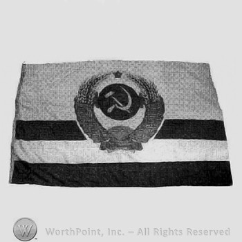 Flag with sickle and hammer inside an wreath.