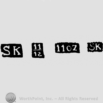 The letters SK written in uppercase; the fraction 11/12, the word '11OZ'; letters SK written in uppercase