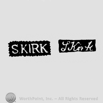 The name S Kirk written with uppercase letters or with lowercase letters and leaned to the right
