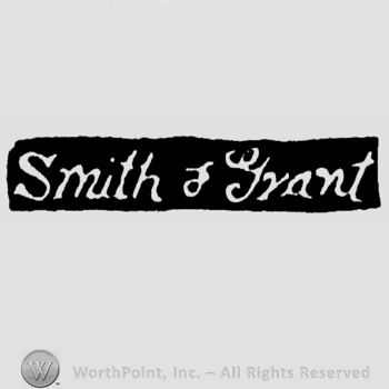 The name Smith & Grant written with lowercase letters, leaned to the right