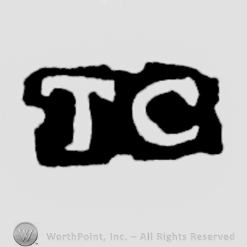 The letters TC written in uppercase
