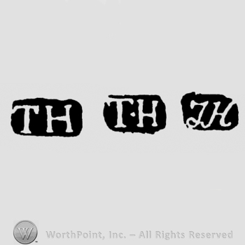The letters TH written in uppercase either straight or handwritten