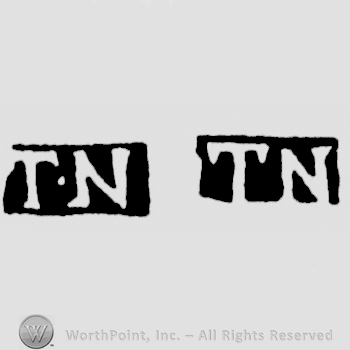The letters T N written in uppercase