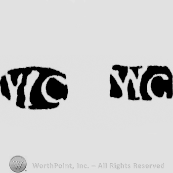 The letters WC written in uppercase