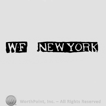 The letters WF and the name New York all written with uppercase letters