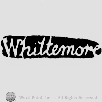 The name Whittemore handwritten with lowercase letters, leaned to the right