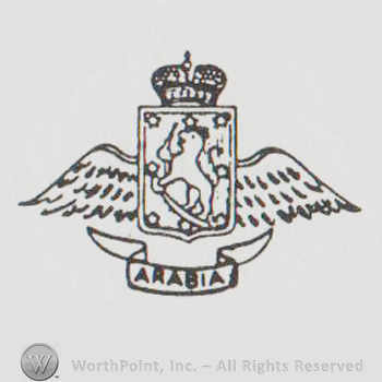 a crown above a shield with wings on the outside and a lion drawn on it above a banner with ARABIA
