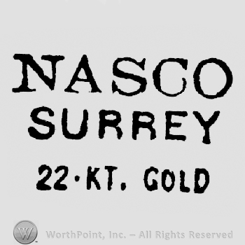 Nasco written above Surrey written above 22 KT. Gold