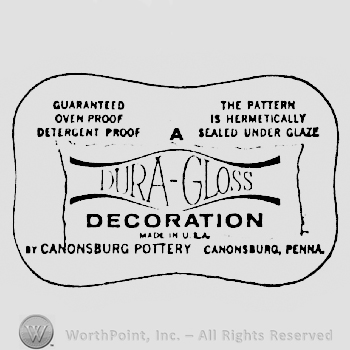 A written above Dura-Gloss written above Decoration written above Made in U.S.A. written above Canonsburg Pottery, Cannonsburg, Penna, all in a curved shape frame
