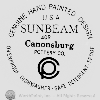 Genuine Hand Painted Design arched written above USA written above Sunbeam above 409 qabove Canonsburg, above Pottery Co. written above a C with a P inside it, above Ovenproof Dishwasher Safe Detergent Proff written arched
