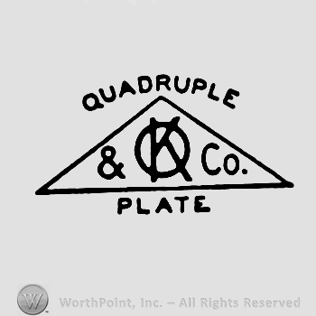 A triangle with uppercase entwined letters KO and '&Co' written inside; Quadruple Plate written above and below with uppercase letters