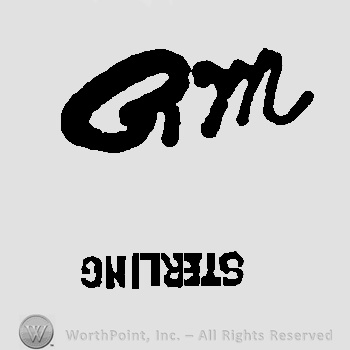 Letters QM handwritten.