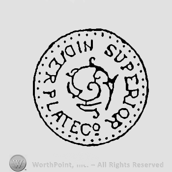 A circle enclosing a flower and the words Superior Silver Plate written with uppercase letters. 