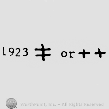 The equal sign with a horizontal line over it and two plus signs preceded by number 1923.