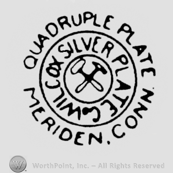 A double circle enclosing two crossed hammers and the text Wilcox Silver PLate Co. written in uppercase letters, and the text Quadruple Plate Meriden Conn.written on the edge in uppercase letters.