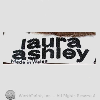 Clothing label : Laura Mountney Ashley.