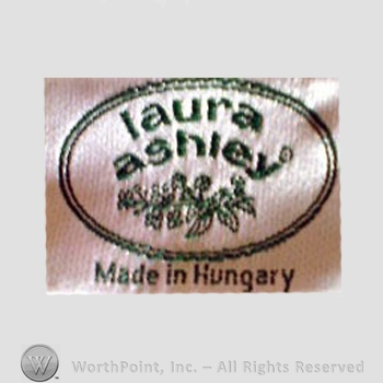 Clothing label : Laura Mountney Ashley.