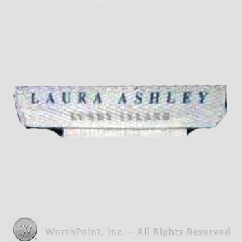 Clothing label : Laura Mountney Ashley.