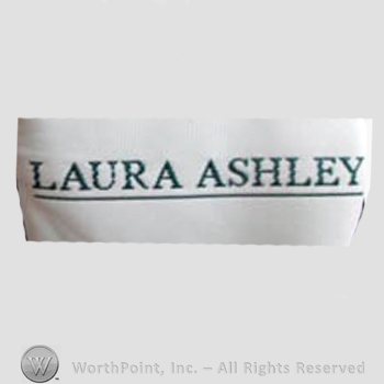 Clothing label : Laura Mountney Ashley.