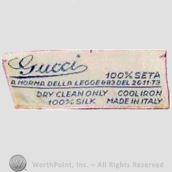 Clothing label : Guccio Gucci.
