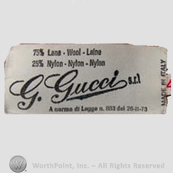 Clothing label : Guccio Gucci.