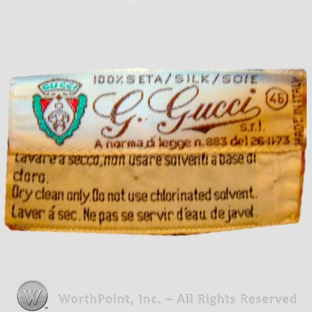 Clothing label : Guccio Gucci.