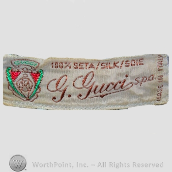 Clothing label : Guccio Gucci.