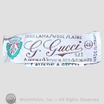 Clothing label : Guccio Gucci.