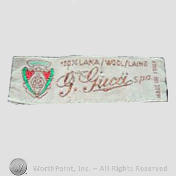 Clothing label : Guccio Gucci.