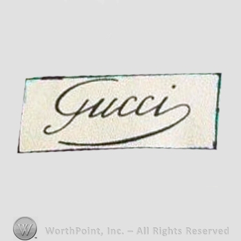 Clothing label : Guccio Gucci.