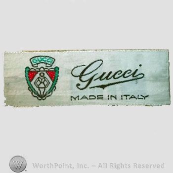 Clothing label : Guccio Gucci.