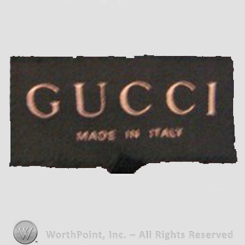 Clothing label : Guccio Gucci.