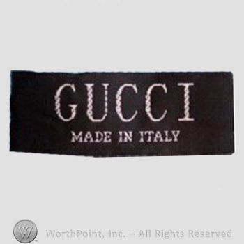 Clothing label : Guccio Gucci.