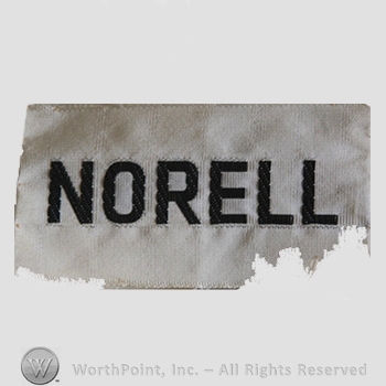 Clothing label : Norman Norell.